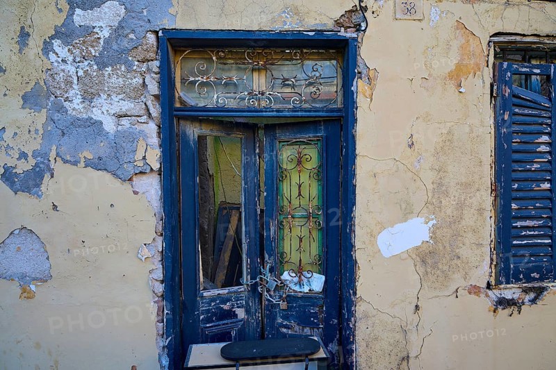 Weathered door and shutters on an old, dilapidated building with peeling paint, Rhodes Old Town, Rhodes Town, Rhodes, Dodecanese, Greek Islands, Greece