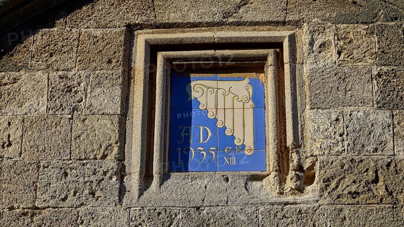 Kasteliani Public Library, Italian coat of arms, Historical façade with a decorative relief and the inscription from 1935 integrated into a stone wall, Rhodes Old Town, Rhodes Town, Rhodes, Dodecanese, Greek Islands, Greece