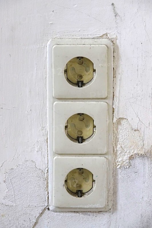 Symbolic image of need for refurbishment, sockets with child protection, Germany