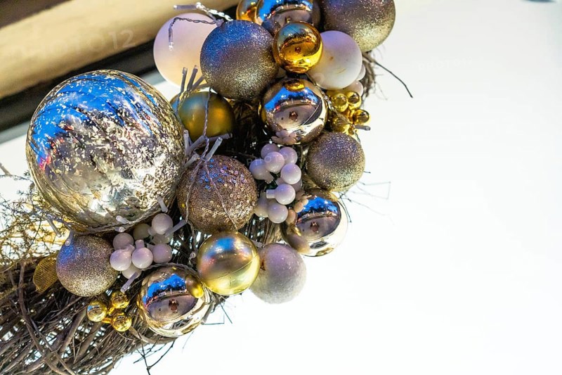 Christmas balls and lights hanging at night in bayonne, france, creating a festive atmosphere