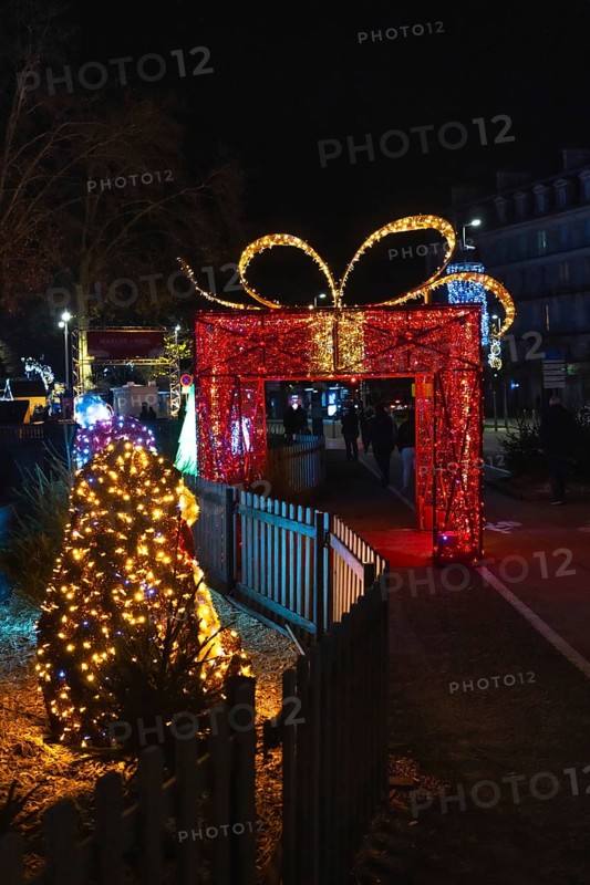 Christmas lights illuminating a giant gift shaped arch during the festive season in bayonne, france, creating a magical atmosphere