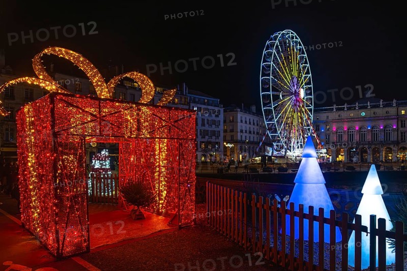 Festive christmas decorations illuminating bayonne's city center at night, creating a magical atmosphere