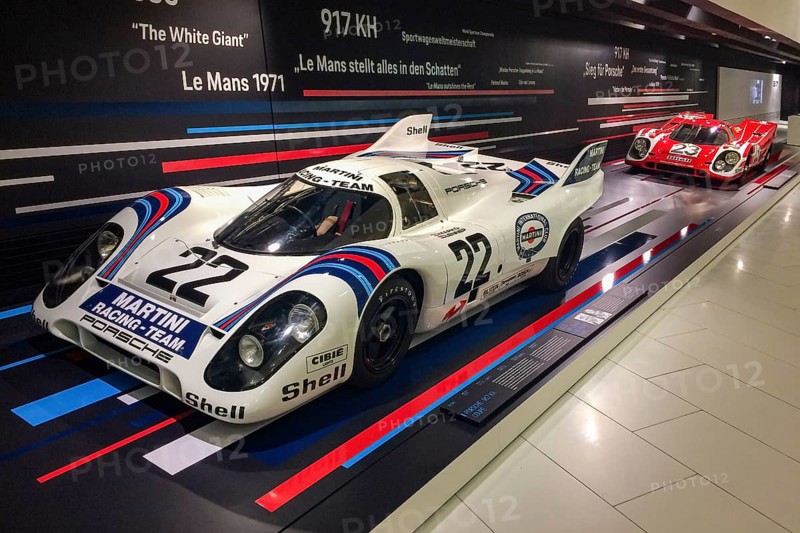 In the front, historic Porsche 917 No. 22 racing car with magnesium cage by racing driver Dr Helmut Marko Gijs van Lennep, overall winner of the 24 Hours 24 Hours of Le Mans 1971, small in the background Porsche 917 KH short tail from 1970 at the first Porsche overall victory of the 24 Hours 24 Hours of Le Mans by racing driver Hans Hermann Richard Attwood, Porsche Museum, Stuttgart Zuffenhausen, Baden-Württemberg, Germany