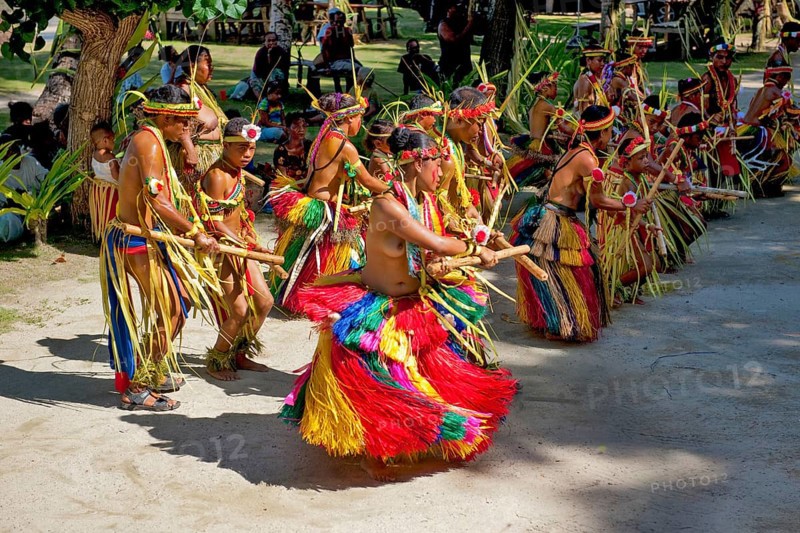 Traditional group of dancers from Yap Island dancing in historical traditional costume headdress performing traditional ritual bamboo dance stick dance with bamboo sticks ritual, Yap Island, Yap State, Caroline Islands, FSM, Federated States of Micronesia, Australia, Oceania