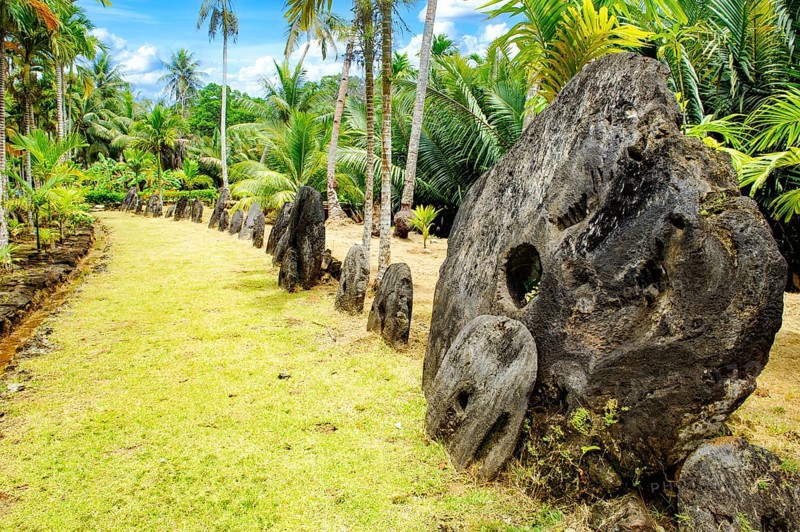 Oversized large giant stone coins real currency in stone money bank stone money bank in jungle of Yap Island, Yap Island, Yap State, Caroline Islands, FSM, Federated States of Micronesia, Australia, Oceania