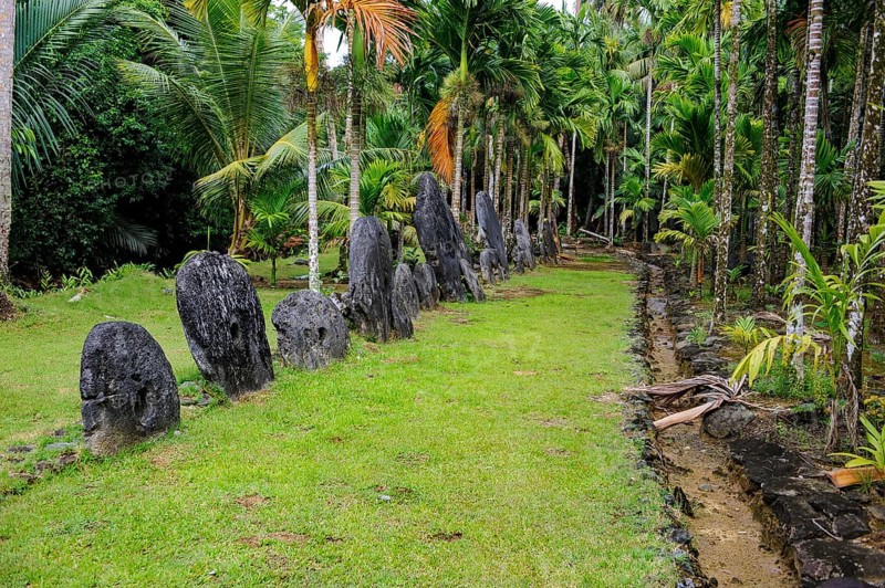 Oversized large giant stone coins real currency in stone money bank stone money bank in jungle of Yap Island, Yap Island, Yap State, Caroline Islands, FSM, Federated States of Micronesia, Australia, Oceania