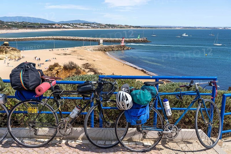 Bicycles with luggage, above the beach Praia da Batata, in the city centre of Lagos, in the west of the Algarve, Portugal