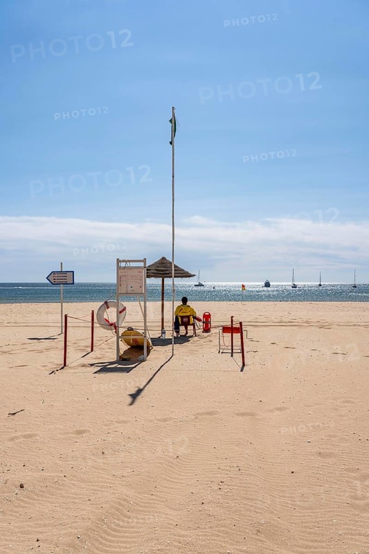 The Praia de São Roque beach, east of Lagos town centre, quite empty, lifeguards on duty, off-season, in the west of the Algarve, Portugal