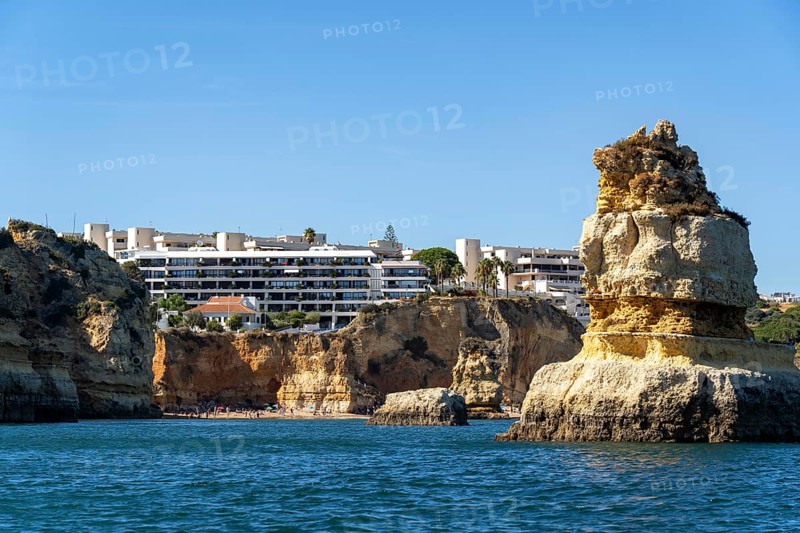 Praia Dona Ana beach, hotel buildings, Ponta da Piedade rocky coast, rugged coastal landscape, right next to the centre of Lagos, in the west of the Algarve, Portugal