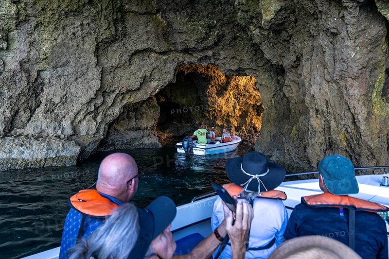 Tour with a small motorboat to the Ponta da Piedade rocky coast, rugged coastal landscape, right next to the city centre of Lagos, in the west of the Algarve, Portugal