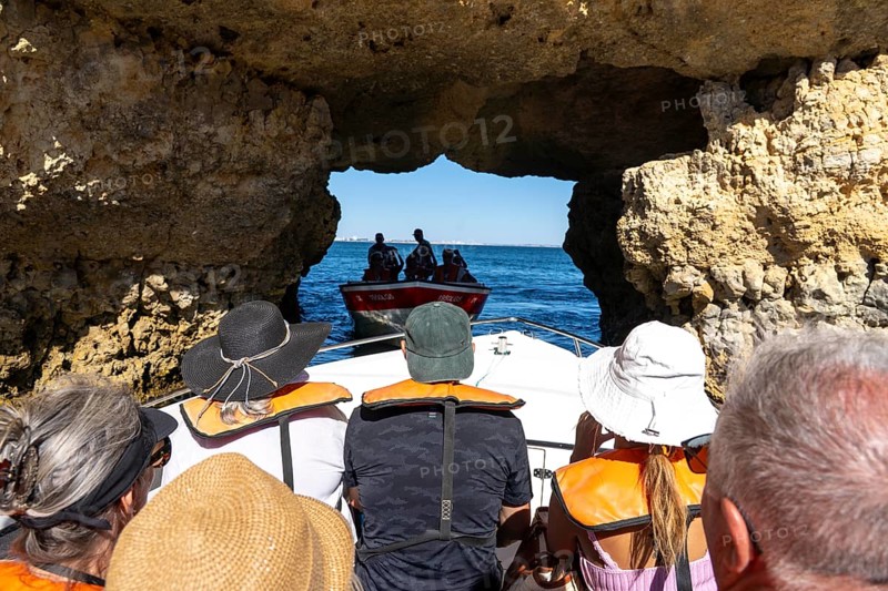 Tour with a small motorboat to the Ponta da Piedade rocky coast, rugged coastal landscape, right next to the city centre of Lagos, in the west of the Algarve, Portugal