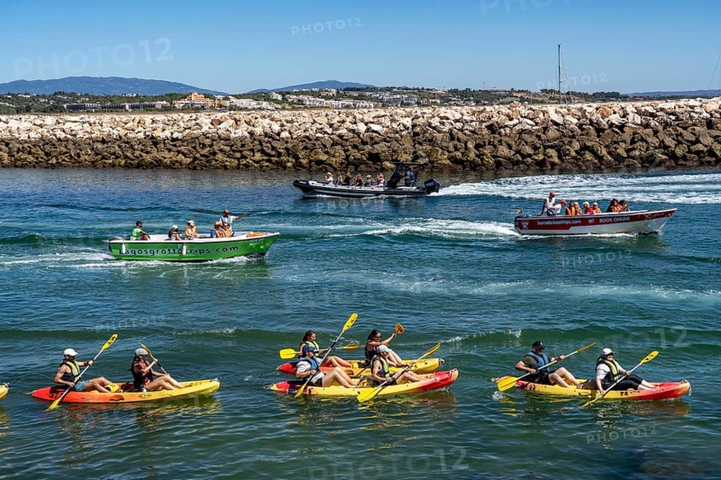 Kayak tours to the rocky coast of Ponta da Piedade, groups of tourists kayak on the sea to the rugged coastline of Lagos, in the west of the Algarve, Portugal
