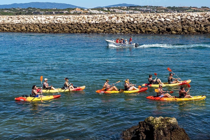 Kayak tours to the rocky coast of Ponta da Piedade, groups of tourists kayak on the sea to the rugged coastline of Lagos, in the west of the Algarve, Portugal