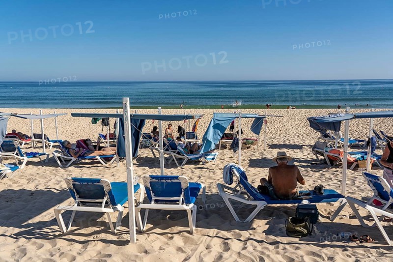 Kilometre-long sandy beach Praia do Barril, on the island off Santa Luzia, Algarve, Portugal