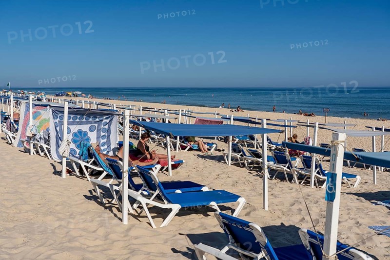 Kilometre-long sandy beach Praia do Barril, on the island off Santa Luzia, Algarve, Portugal