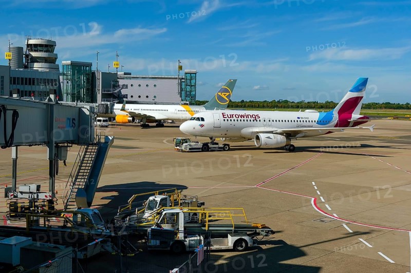 Düsseldorf, North Rhine-Westphalia, Germany - Düsseldorf Airport, aircraft of the airlines Eurowings and Condor at the terminal with air traffic control tower