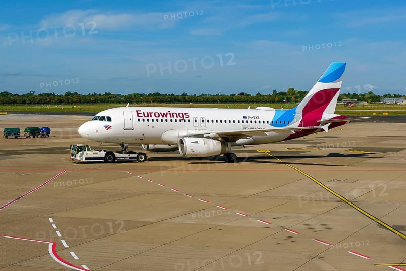 Düsseldorf, North Rhine-Westphalia, Germany - Düsseldorf Airport, Eurowings aircraft being towed by Lufthansa LEO on the apron towards the runway, pushback