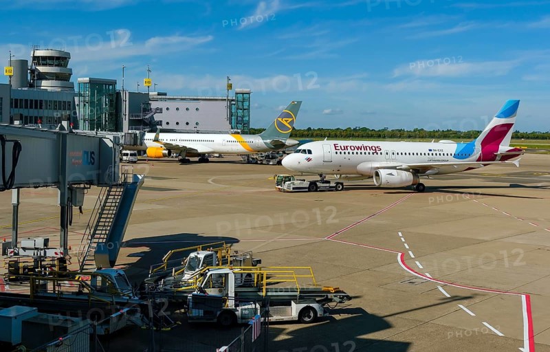 Düsseldorf, North Rhine-Westphalia, Germany - Düsseldorf Airport, aircraft of the airlines Eurowings and Condor at the terminal with air traffic control tower