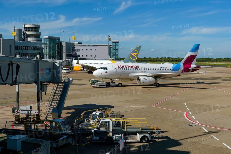 Düsseldorf, North Rhine-Westphalia, Germany - Düsseldorf Airport, aircraft of the airlines Eurowings and Condor at the terminal with air traffic control tower