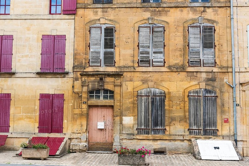 Historic house facade, abandoned building, yellow sandstone, Marville, Renaissance village, Département Meuse, Grand Est, France