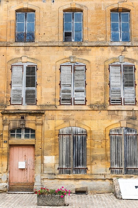 Historic house facade, abandoned building, yellow sandstone, Marville, Renaissance village, Département Meuse, Grand Est, France