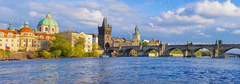Panorama of old town with Charles Bridge on Vltava river and Old Town Bridge Tower, famous tourist destination in Prague, Czech Republic
