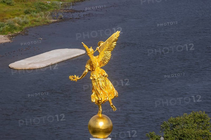 Fama (the goddess of rumours) on the dome of the Academy of Fine Arts, with the pillar foundation of the former Carola bridges, Dresden, Saxony, Germany