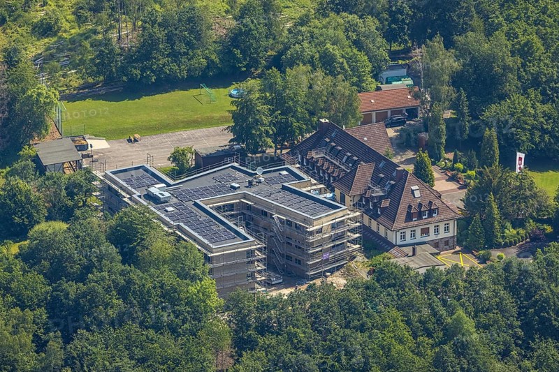 Aerial view, construction site and new building for the children's home Marienfrieden, SkF Hochsauerland Sozialdienst kath. Frauen e.V., Hüsten, Arnsberg, Sauerland, North Rhine-Westphalia, Germany, construction work, construction area, building site, building plots, construction project, construction site, DE, Europe, Haus Marienfrieden, Hochsauerlandkreis, children's home, aerial photograph, aerial photography, aerial photography, new building, photovoltaics, photovoltaic system, SkF Hochsauerland, solar, solar system, solar energy, solar energy, overview, bird's-eye view, birds-eyes view, overview