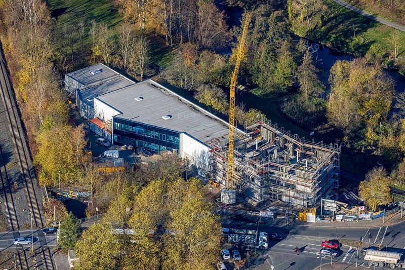 Aerial view, construction site with extension Eglo Leuchten Handels GmbH in the district Neheim in Arnsberg, Sauerland, North Rhine-Westphalia, Germany, extension, Arnsberg, construction work, construction area, construction site, building plots, construction crane, construction project, construction site, DE, Europe, Kleinbahnstraße, aerial view, aerial photography, aerial photography, new building, overview, bird's eye view, birds-eyes view, overview