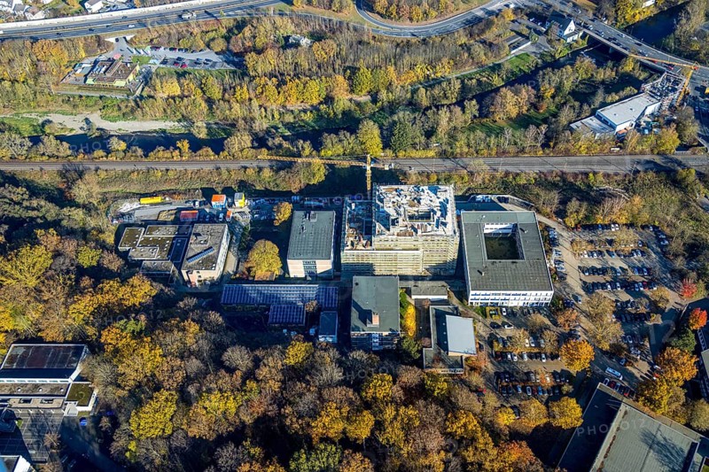 Aerial view, construction site and new building at the Berufskolleg Berliner Platz in the district Hüsten in Arnsberg, Sauerland, North Rhine-Westphalia, Germany, Arnsberg, construction work, construction area, construction site, building plots, construction crane, construction project, construction site, DE, Europe, aerial view, aerial photography, aerial photography, new building, overview, bird's eye view, birds-eyes view, overview