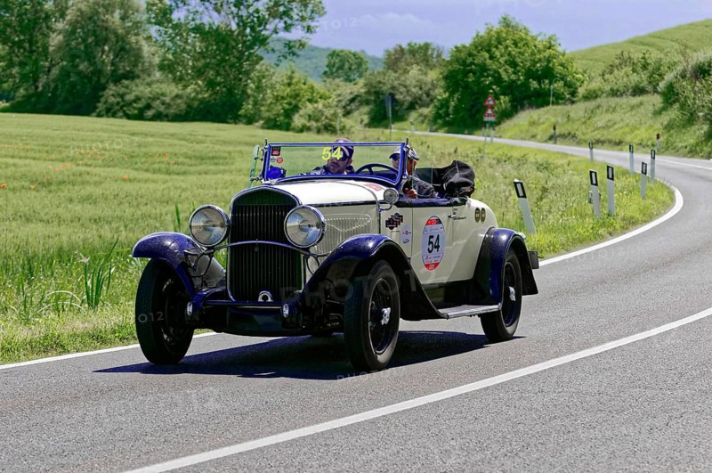 A white and blue classic car with driver on a sunny country road, classic car, car race, Mille Miglia, 1000 Miglia, 2015, Tuscany, Rome Lake Garda, Italy