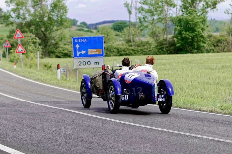 Blue classic car in the direction of Siena on a country road through the Italian countryside, classic car, car race, Mille Miglia, 1000 Miglia, 2015, Tuscany, Rome Lake Garda, Italy
