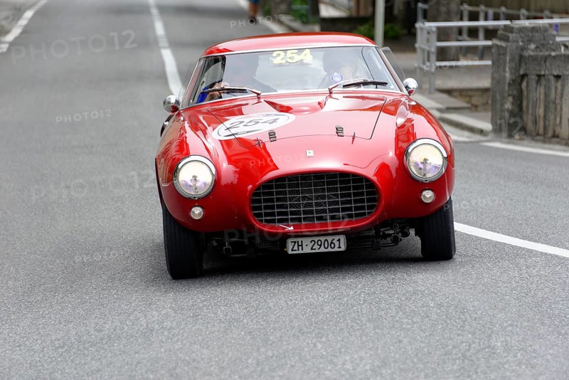 No. 254, Ferrari 250 MM berinetta Pinin Farina, built in 1953, red retro car drives head-on on an empty road, Mille Miglia 2014 or 1000 Miglia, classic car race, San Marino, Italy
