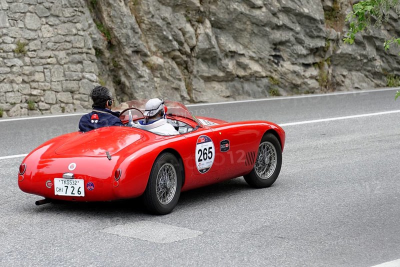 No. 265, O.S.C.A. MTA 1500 2AD, year of construction 1953, red vintage car driving on a road with stony scenery, Mille Miglia 2014 or 1000 Miglia, classic car race, San Marino, Italy