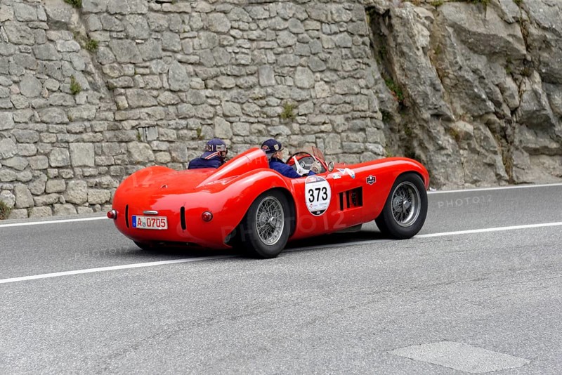 No. 373, Maserati 300 S Fantuzzi, year of construction 1955, Red racing car driving along a winding road with stony scenery, Mille Miglia 2014 or 1000 Miglia, classic car race, San Marino, Italy