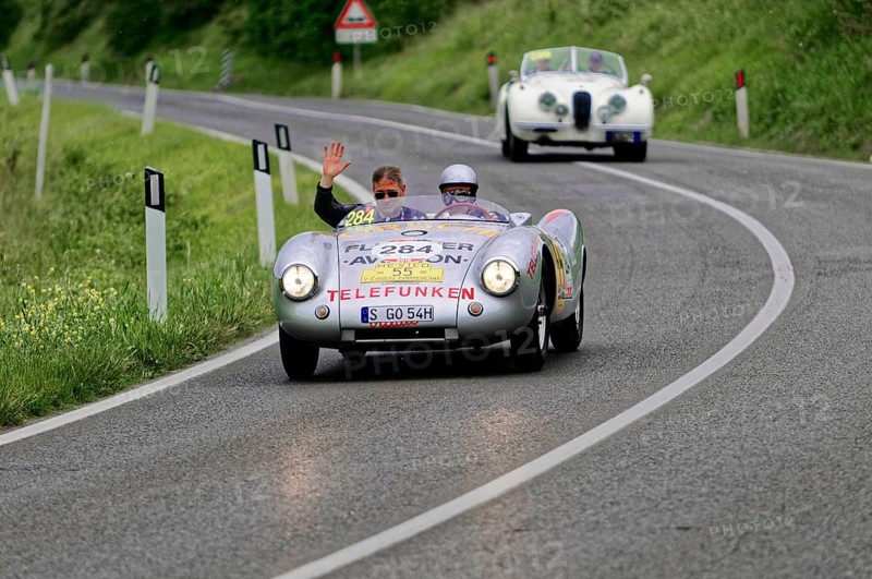 Silver classic car on country road, two people waving from the vehicle, classic car, car race, Mille Miglia, 1000 Miglia, 2015, Tuscany, Rome Lake Garda, Italy