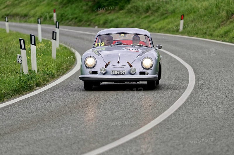 Silver classic car on a winding road through green hills, classic car, car race, Mille Miglia, 1000 Miglia, 2015, Tuscany, Rome Lake Garda, Italy