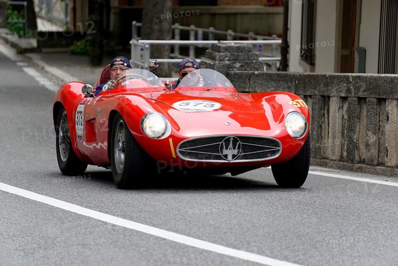 No. 373, Maserati 300 S Fantuzzi, built in 1955, red Maserati vintage car driving on a road in an urban area, Mille Miglia 2014 or 1000 Miglia, vintage car race, San Marino, Italy