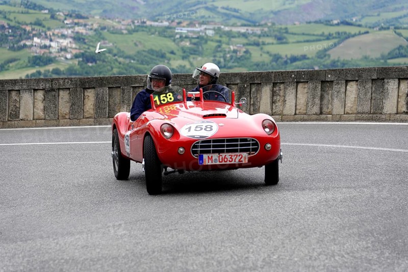 Stanguellini 1100 Sport, built in 1948, red vintage sports car with two occupants on a winding road, Mille Miglia 2014 or 1000 Miglia, vintage car race, San Marino, Italy