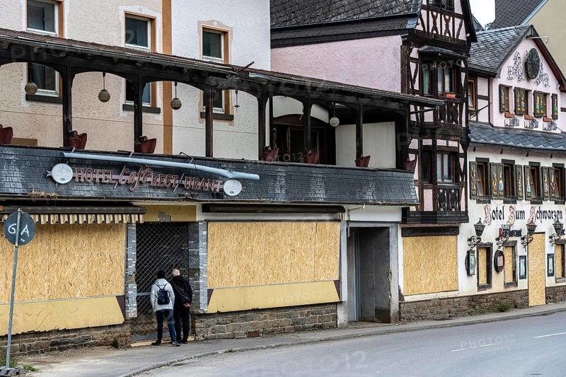 Reconstruction in the Ahr Valley, after the flood of July 2021, buildings that have not yet been renovated or demolished can be found in many towns, but most buildings have now been repaired or rebuilt, Central Hotel and Zum Schwarzen Kreuz near Altenahr, Rhineland-Palatinate