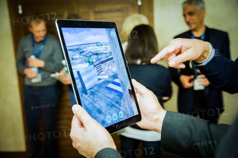 ITA Italy Castelfalfi participants try out a virtual tour via pad during a conference for tourism managers