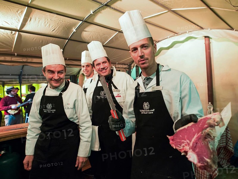 ITA Italy Castelfalfi chefs show the quality of meat during a meeting for tourism managers