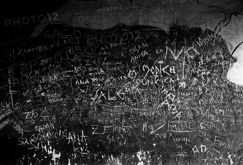 BIH, Bosnia, Screbrenica, 10.07.2005, Graffitti on the wall of the entrance to a discotheque