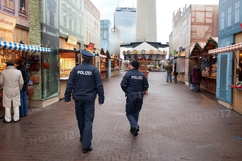 Berlin 2010-11-24 Police officers tour the Christmas market on Alexanderplatz. DEU, Berlin 2010-11-24 Police Guarding a Christmas Market in Downtown Berlin