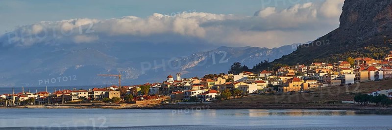 Coastal town at dusk with mountains and cloudy sky, Monemvasia, Monemvassia, Malvasy, Byzantine small town, rocky island, fortress, Laconia, Peloponnese, peninsula, Greece