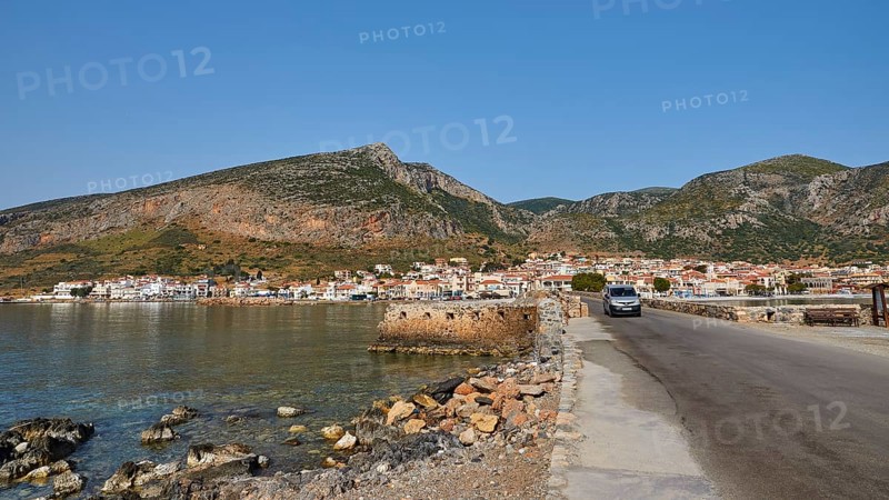 Road leads along the coast of a town against a mountainous backdrop, Monemvasia, Monemvassia, Malvasy, Byzantine small town, rocky island, fortress, Laconia, Peloponnese, peninsula, Greece