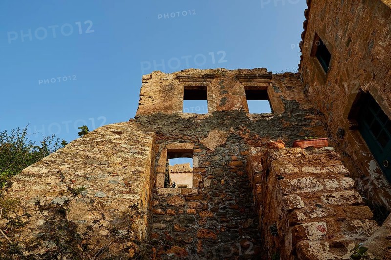 Soft morning light, the remains of an old stone building, window openings, blue sky, dilapidated, Monemvassia, Malvasy, Byzantine small town, rocky island, fortress, Laconia, Peloponnese, peninsula, Greece