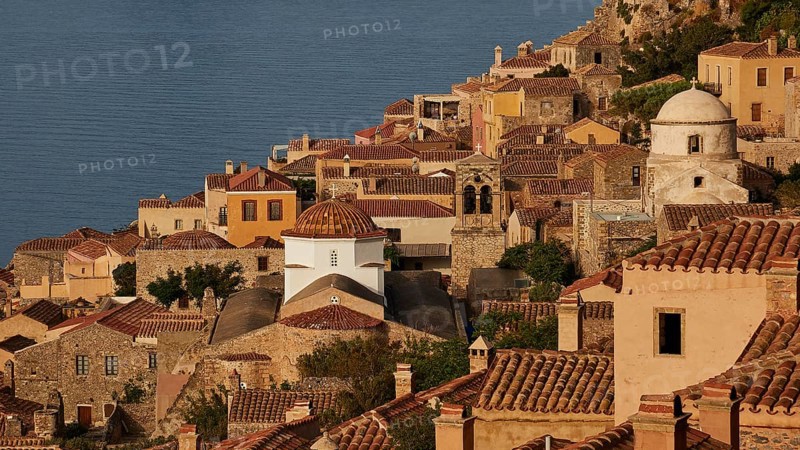 Soft morning light, Holy Church of Christ in Chains, Elkomenos Christos, Classic coastal town with tiled roofs and churches, bathed in warm sunlight, Monemvasia, Monemvassia, Malvasy, Byzantine small town, rocky island, fortress, Laconia, Peloponnese, peninsula, Greece