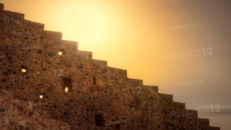 Abstract scene with stone stairs and warm sunset light, Monemvassia, Malvasy, Byzantine small town, rocky island, fortress, Laconia, Peloponnese, peninsula, Greece