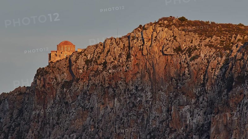 Orhodox church of Hagia Sophia, chapel on bright rock wall in evening light with scenic backdrop, Monemvasia, Monemvassia, Malvasy, small Byzantine town, rocky island, fortress, Laconia, Peloponnese, peninsula, Greece